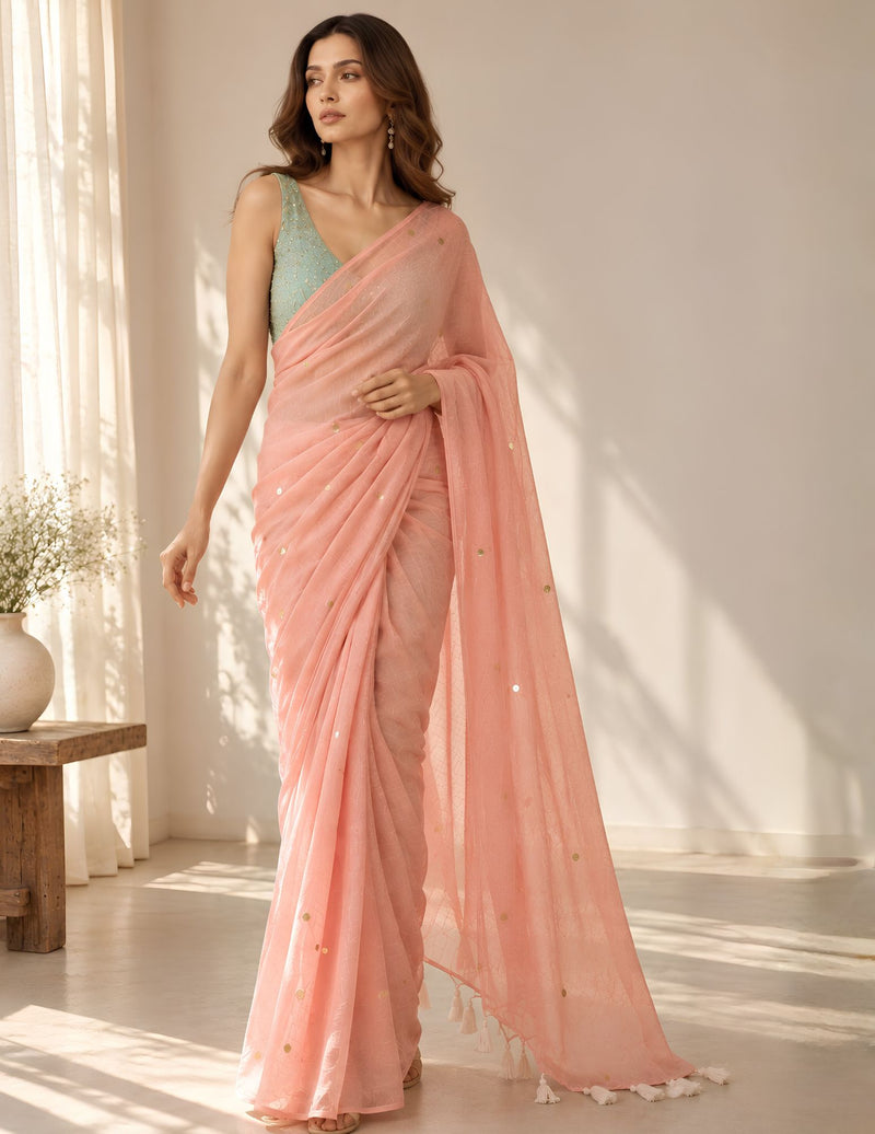 Peach pink mul cotton saree with gold sequin detailing